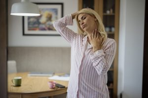person doing a gentle stretching routine at home