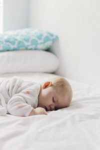 person sleeping peacefully in a dark bedroom